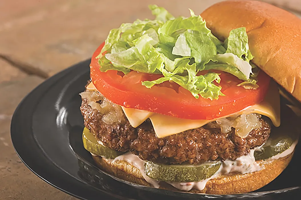 Cheeseburger with lettuce, tomato, and pickles